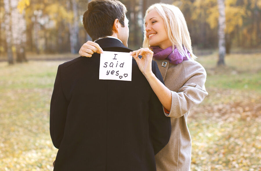 Love, relationships, engagement and wedding concept - man proposing ring woman outdoors, happy romantic couple