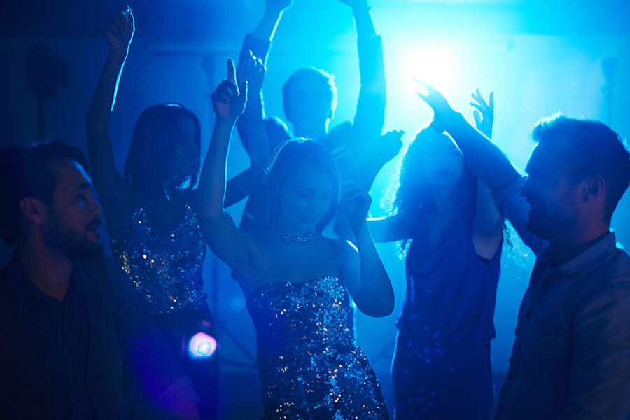 Posh friends enjoying disco in club
